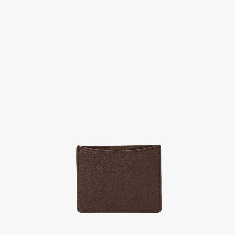 Back panel of STOW London's Cardholder in Espresso pebbled leather on a light grey background featuring the rear slip pocket