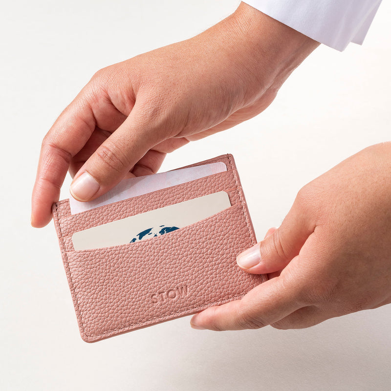 STOW Leather Cardholder in Hazy Blush colour being held by model.
