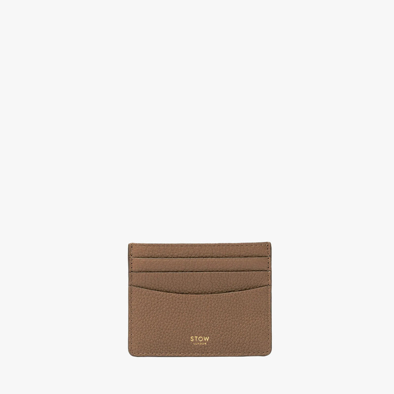 STOW London's Cardholder in Mocha pebbled leather on a light grey background featuring a fine gold embossed logo on the front bottom