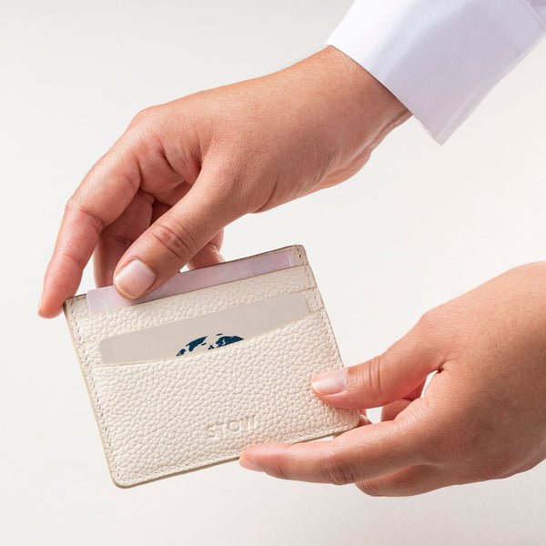 STOW Leather Cardholder in Spring Moon colour being held by model.