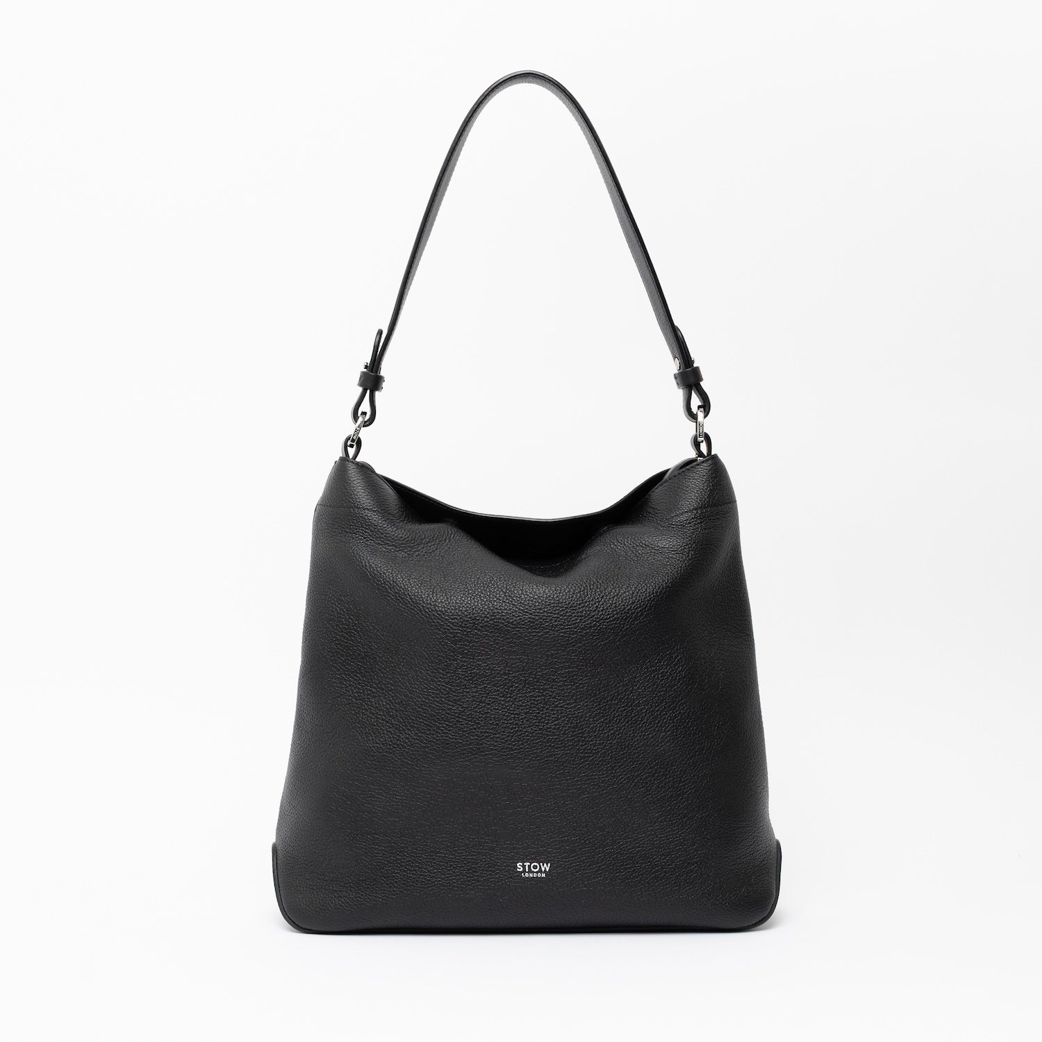 STOW London's Curve in Black leather on a light grey background featuring the detachable shoulder strap with silver hardware