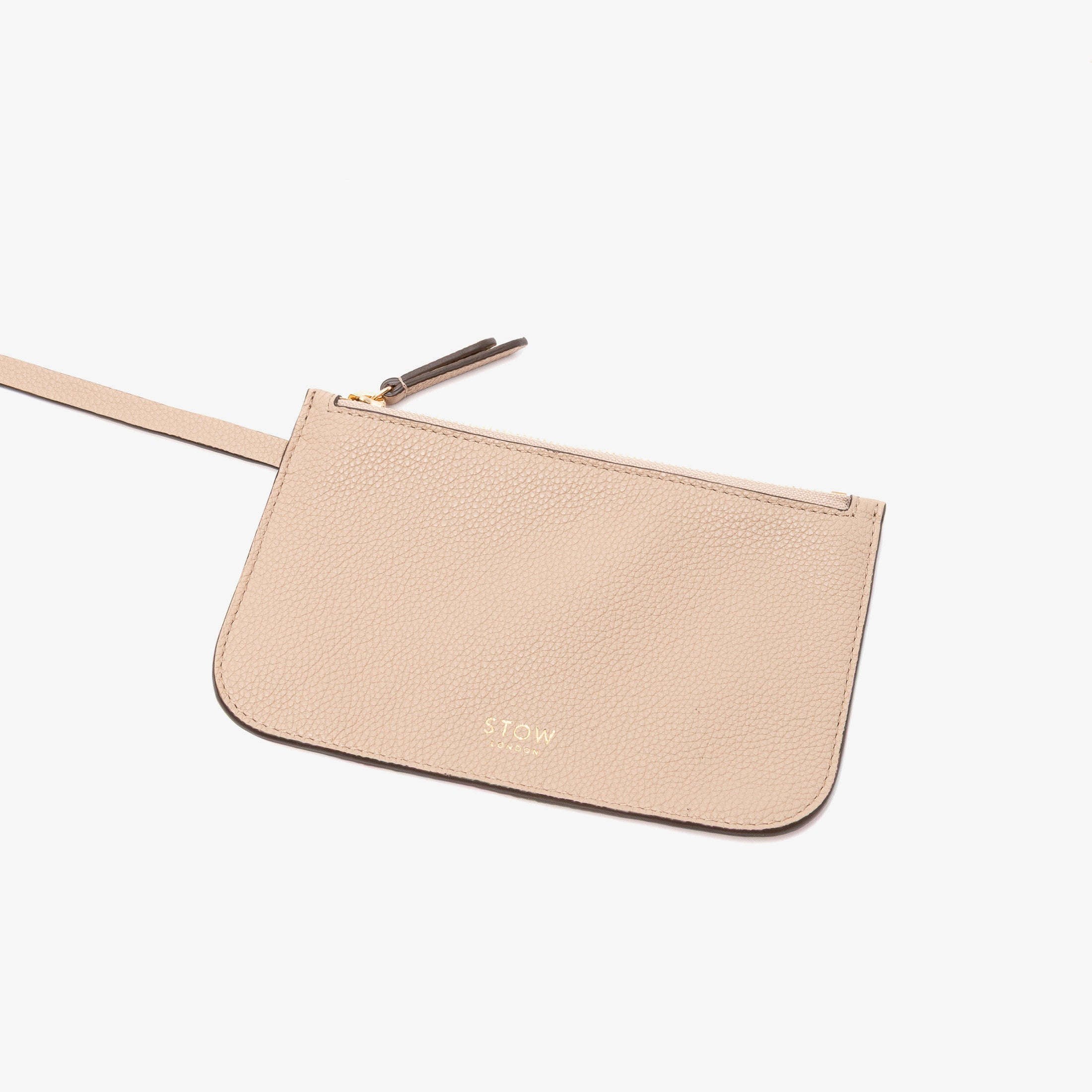 Close up of the detachable interior pouch of Stow London's Curve bag in Camel pebbled leather on a light grey background