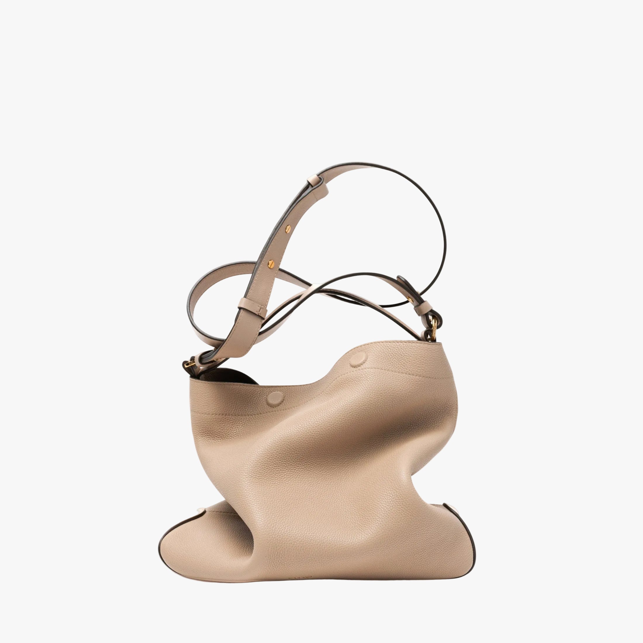 STOW London's Curve bag in Camel pebbled leather featuring its detachable crossbody strap and gold-coated stainless steel hardware on a light grey background