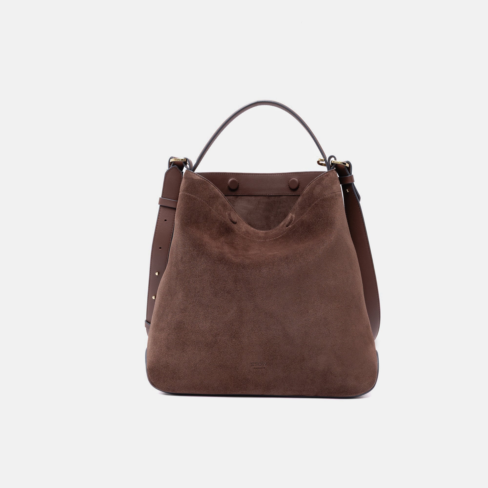 Stow London's Curve bag in Chocolate suede leather with magnets open showing the chocolate suede interior lining featuring gold-coated stainless steel hardware on a light grey background