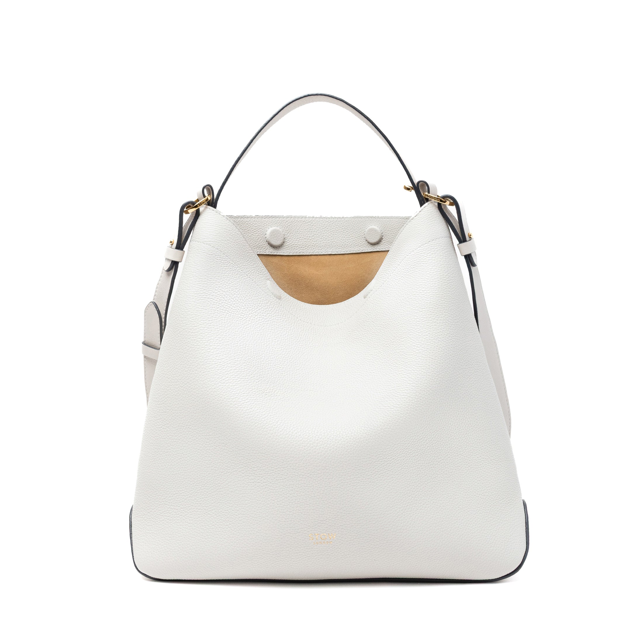 Stow London's Curve bag in Cloud Grey pebbled leather with magnets open showing cognac suede interior featuring gold-coated stainless steel hardware on a light grey background