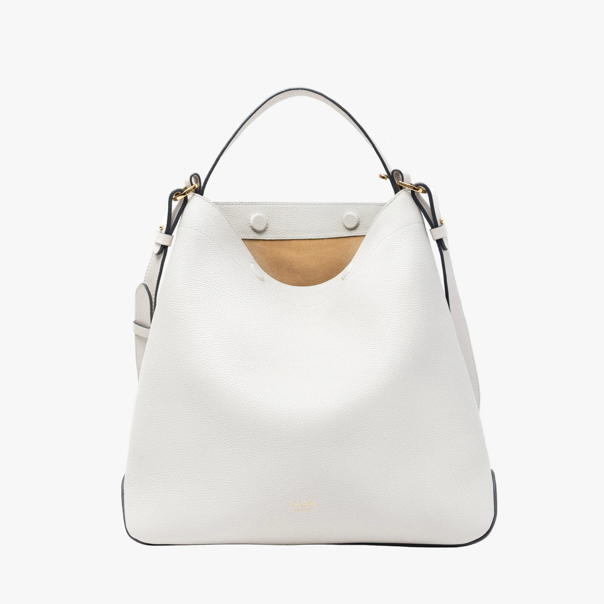 STOW London's Curve bag in Cloud Grey pebbled leather featuring the suede interior lining, concealed magnets, cgold-coated stainless steel hardware on a light grey background