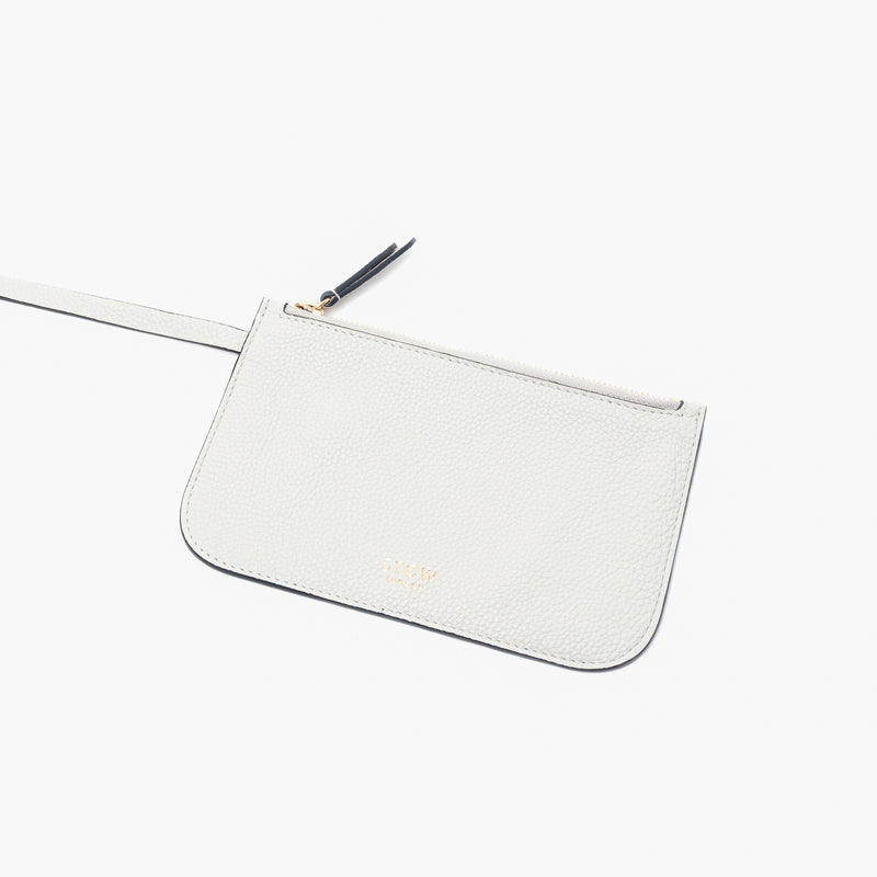 Close up of the detachable interior pouch of Stow London's Curve bag in Cloud Grey pebbled leather on a light grey background