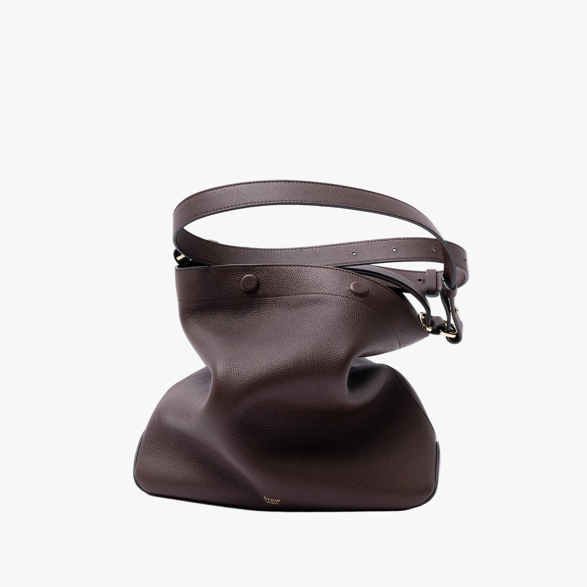 STOW London's Curve Bag in Espresso pebbled leather featuring the detachable crossbody strap and gold-coated stainless steel hardware on a light grey background