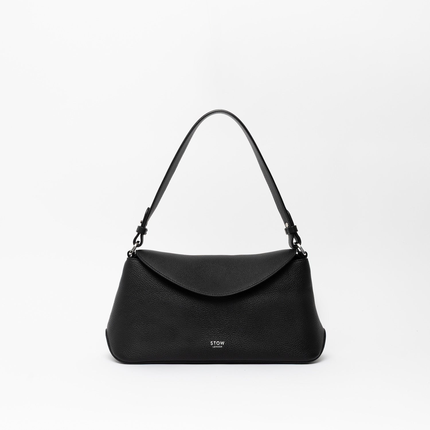 STOW London's East West and detachable shoulder strap in Black leather on a light grey background featuring silver hardware and details 