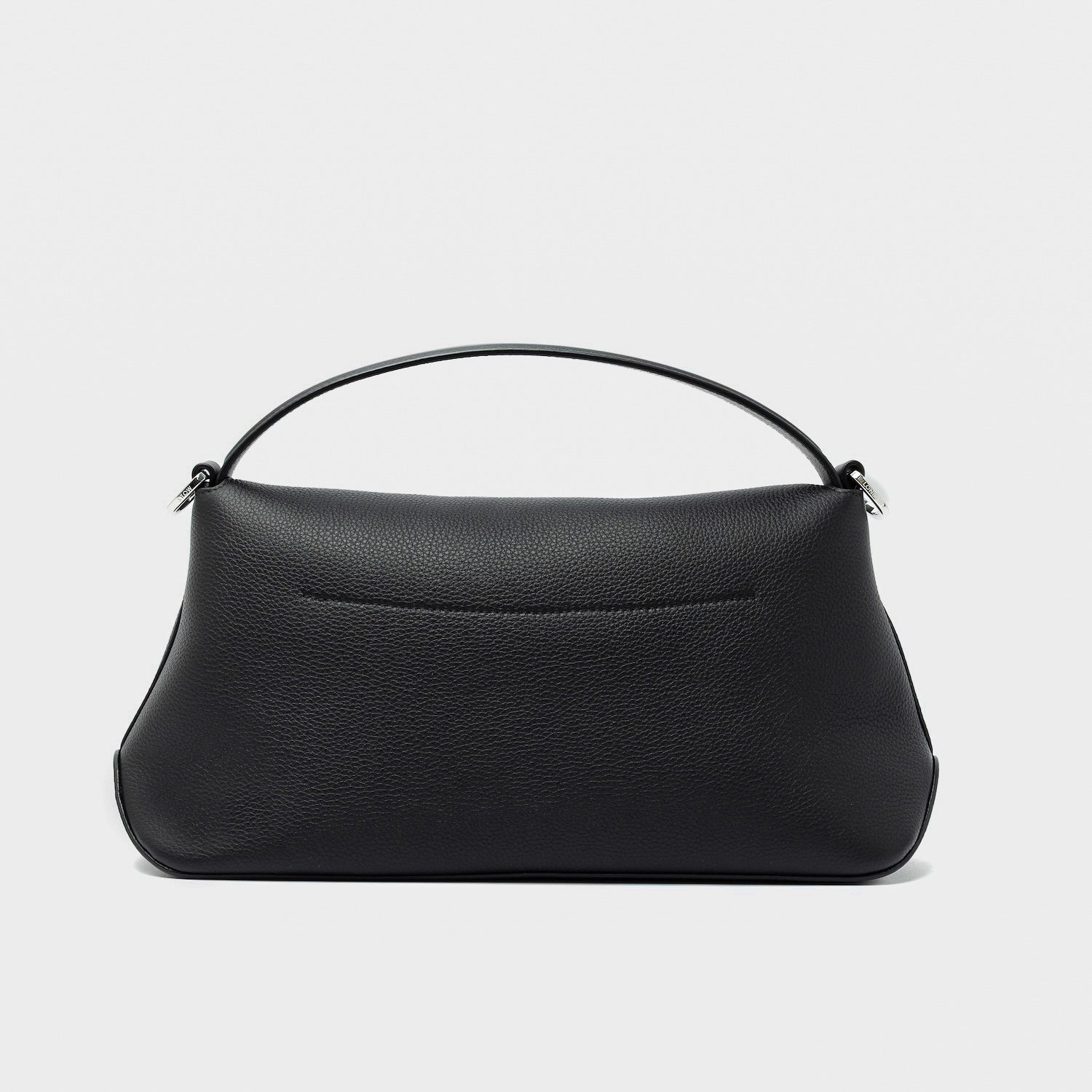 Back panel of STOW London's East West in Black pebbled leather featuring silver stainless steel hardware on a light grey background