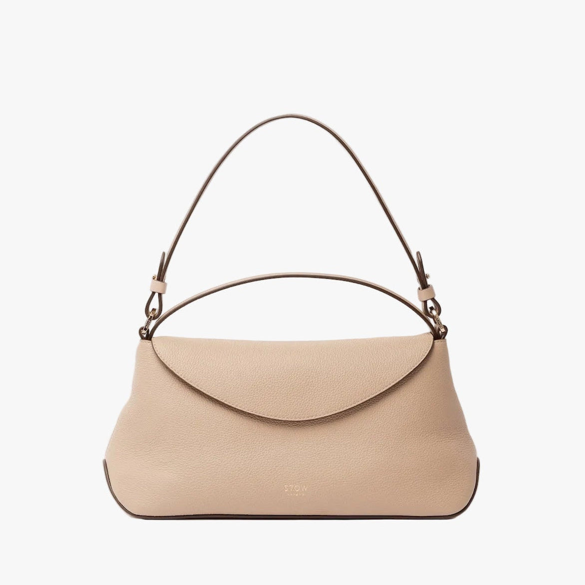 STOW London's East West in Camel leather on a light grey background featuring the detachable shoulder strap and top handle with gold hardware and details 