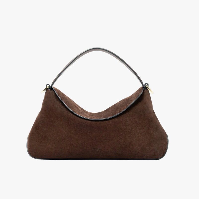 STOW London's East West in Chocolate suede leather featuring gold-coated stainless steel hardware on a light grey background
