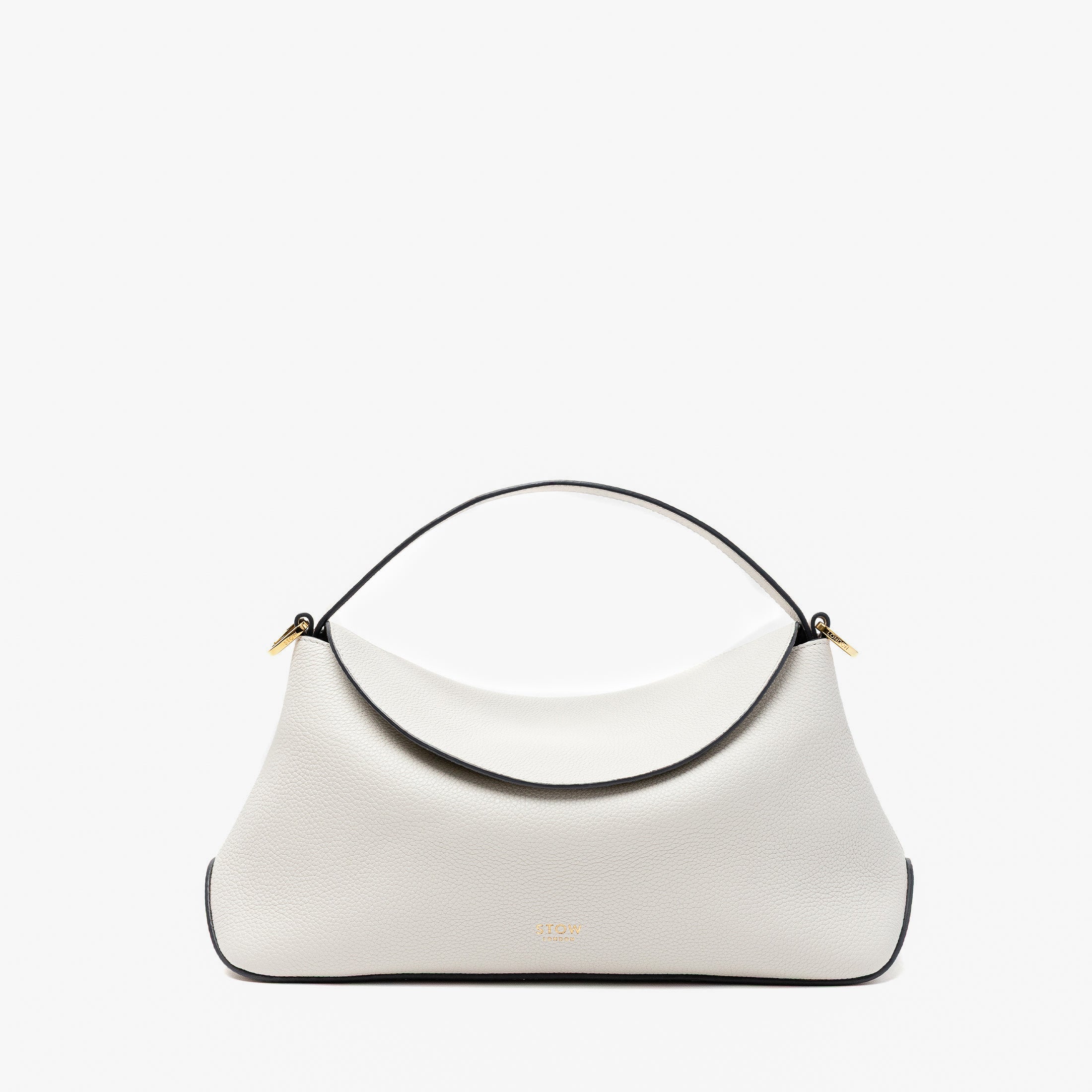 STOW London's East West in Cloud Grey pebbled leather featuring gold-coated stainless steel hardware on a light grey background