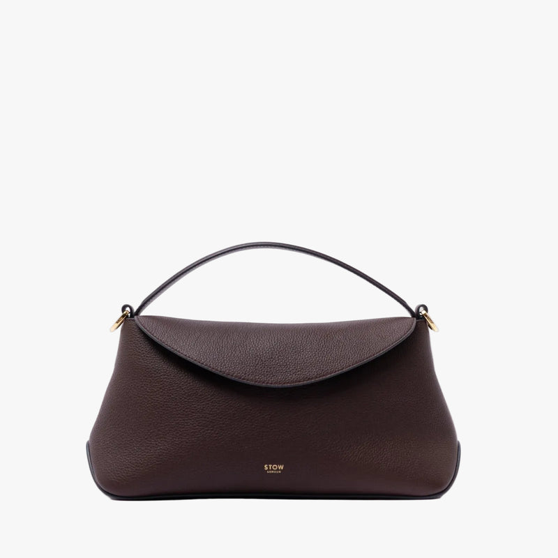 STOW London's East West in Espresso pebbled leather featuring gold-coated stainless steel on a light grey background