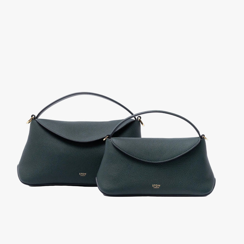 Size comparison of STOW London's Mini East West and East West bags in New Forest pebbled leather on a light grey background featuring gold-coated stainless steel hardware