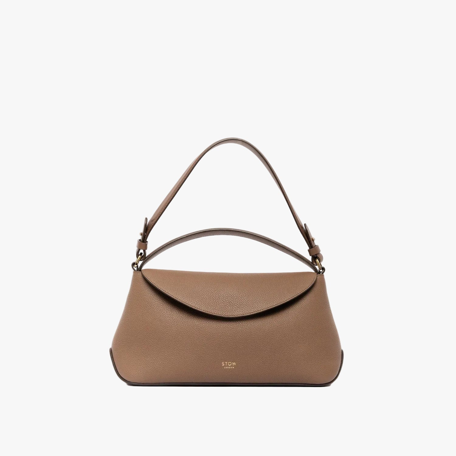 STOW London's East West bag in Mocha pebbled leather with the shoulder strap attached and top handle out featuring gold-coated stainless steel hardware on a light grey background