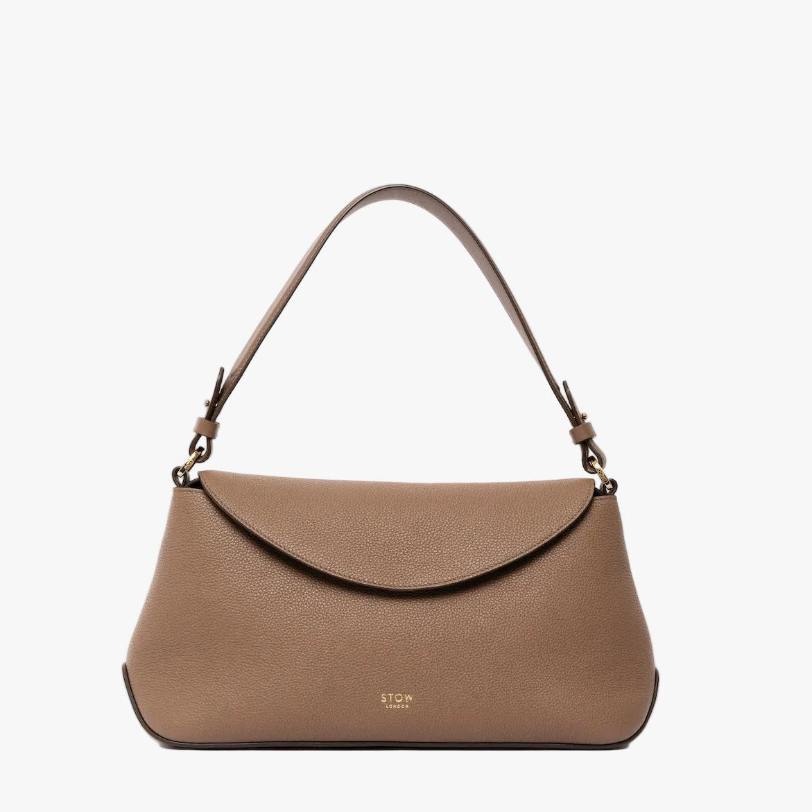STOW London's East West bag in Mocha pebbled leather with the shoulder strap attached and top handle tucked into the bag featuring gold-coated stainless steel hardware on a light grey background