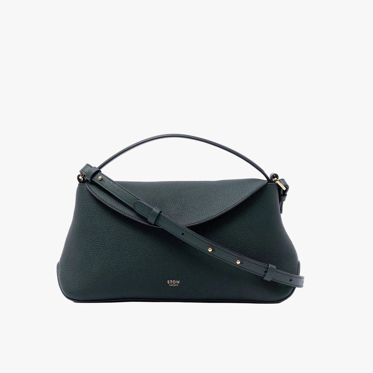 STOW London's East West in New Forest pebbled leather on a light grey background featuring the detachable crossbody strap and gold-coated stainless steel hardware