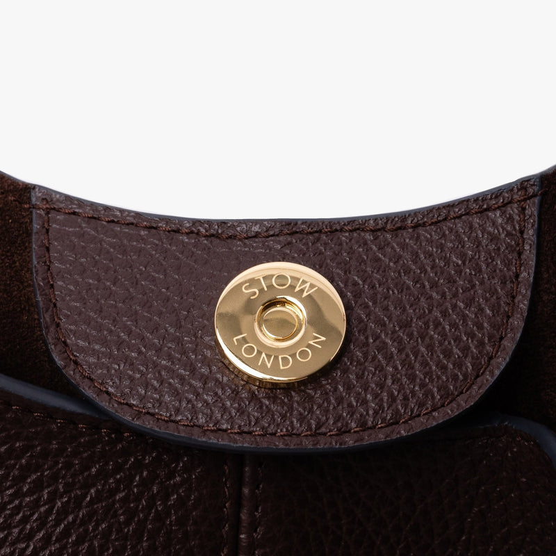 Close up of the magnetic closure on STOW London's Hobo Tote in Espresso pebbled leather 