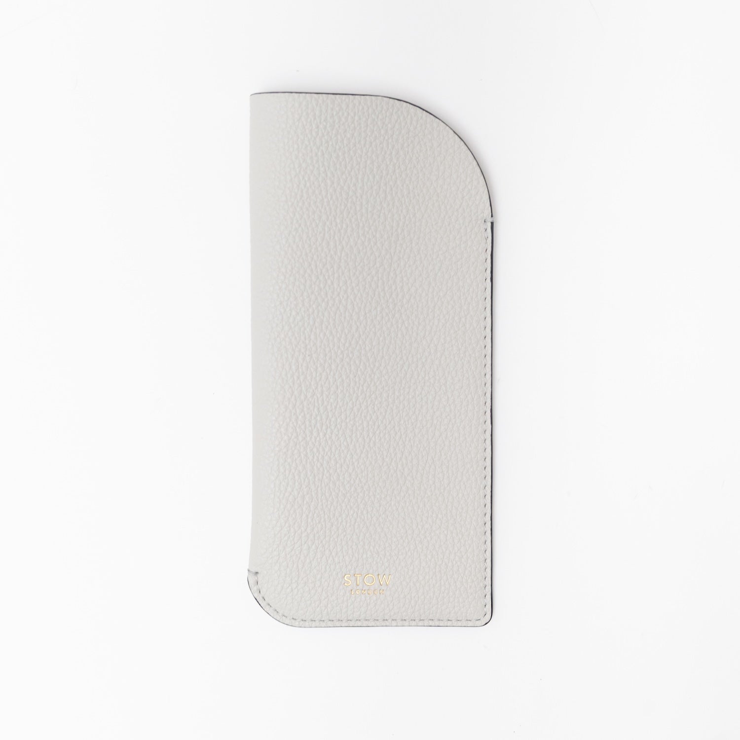 STOW London's Glasses Case in Cloud Grey pebbled leather, featuring a gold logo on a light grey background
