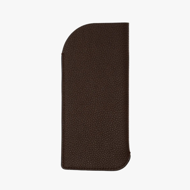 Back panel of STOW London's Glasses Case in Espresso pebbled leather on a light grey background 