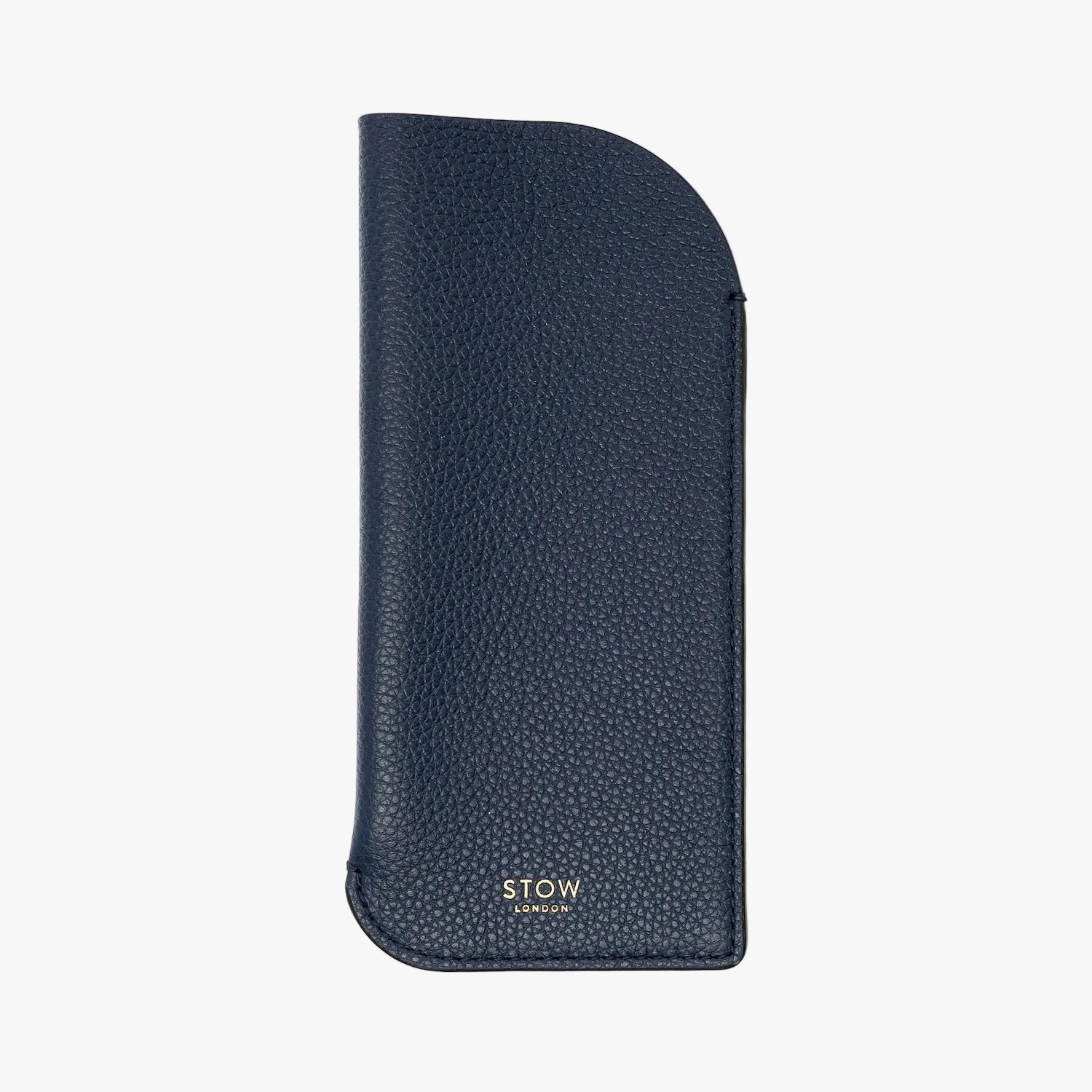 STOW London's Glasses Case in Navy pebbled leather on a light grey background featuring a small gold embossed logo on the front bottom