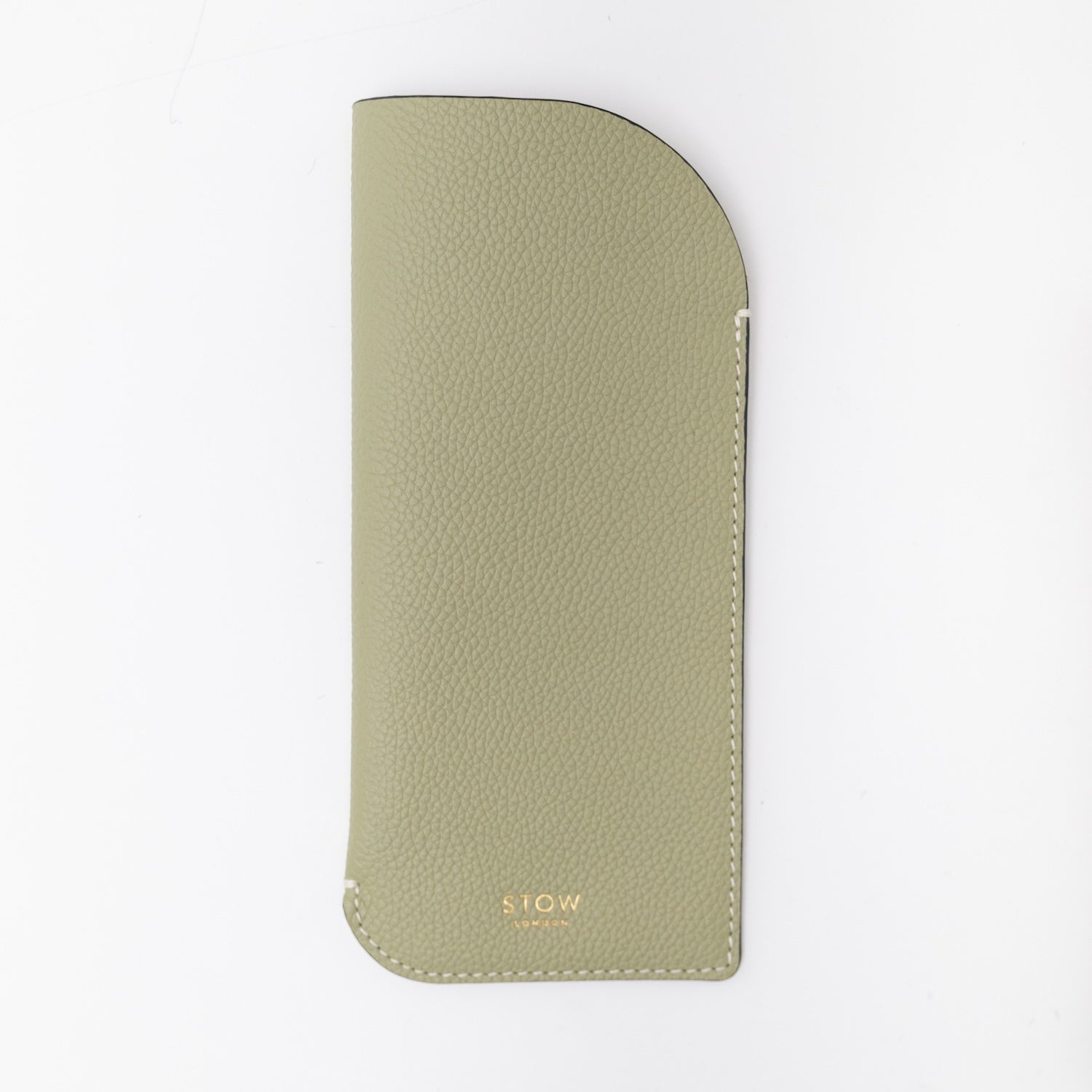 STOW London's Glasses Case in Pale Green pebbled leather, featuring a gold logo on a light grey background