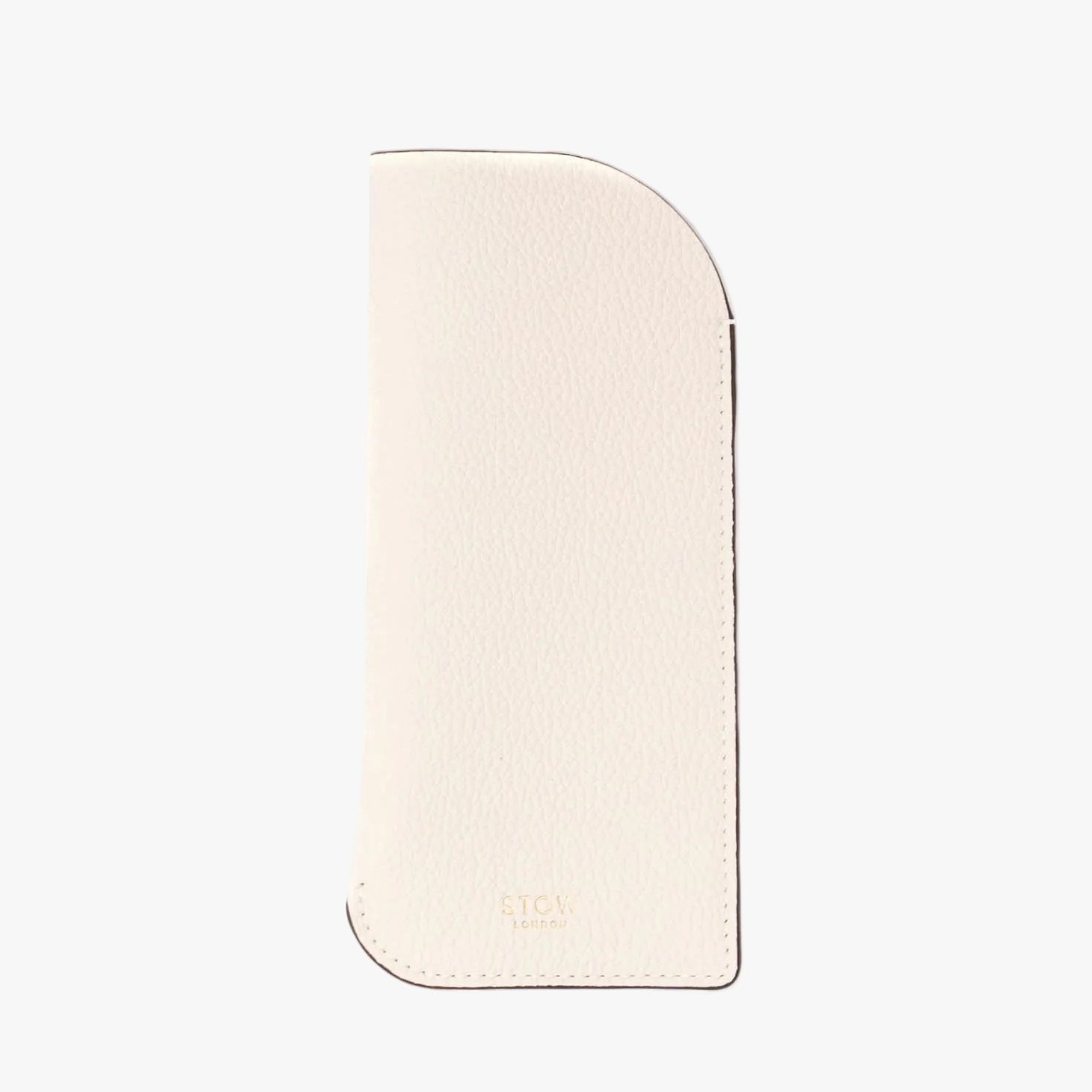 STOW London's Glasses Case in Spring Moon pebbled leather on a light grey background featuring a small gold embossed logo at the bottom 
