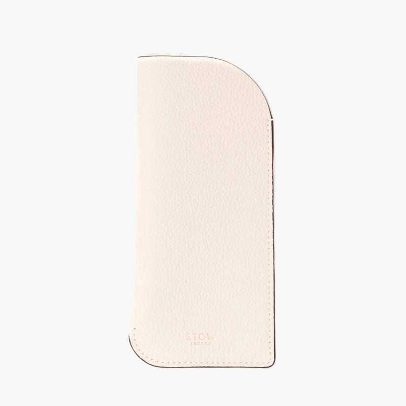 STOW London's Glasses Case in Spring Moon pebbled leather on a light grey background featuring a small gold embossed logo at the bottom 