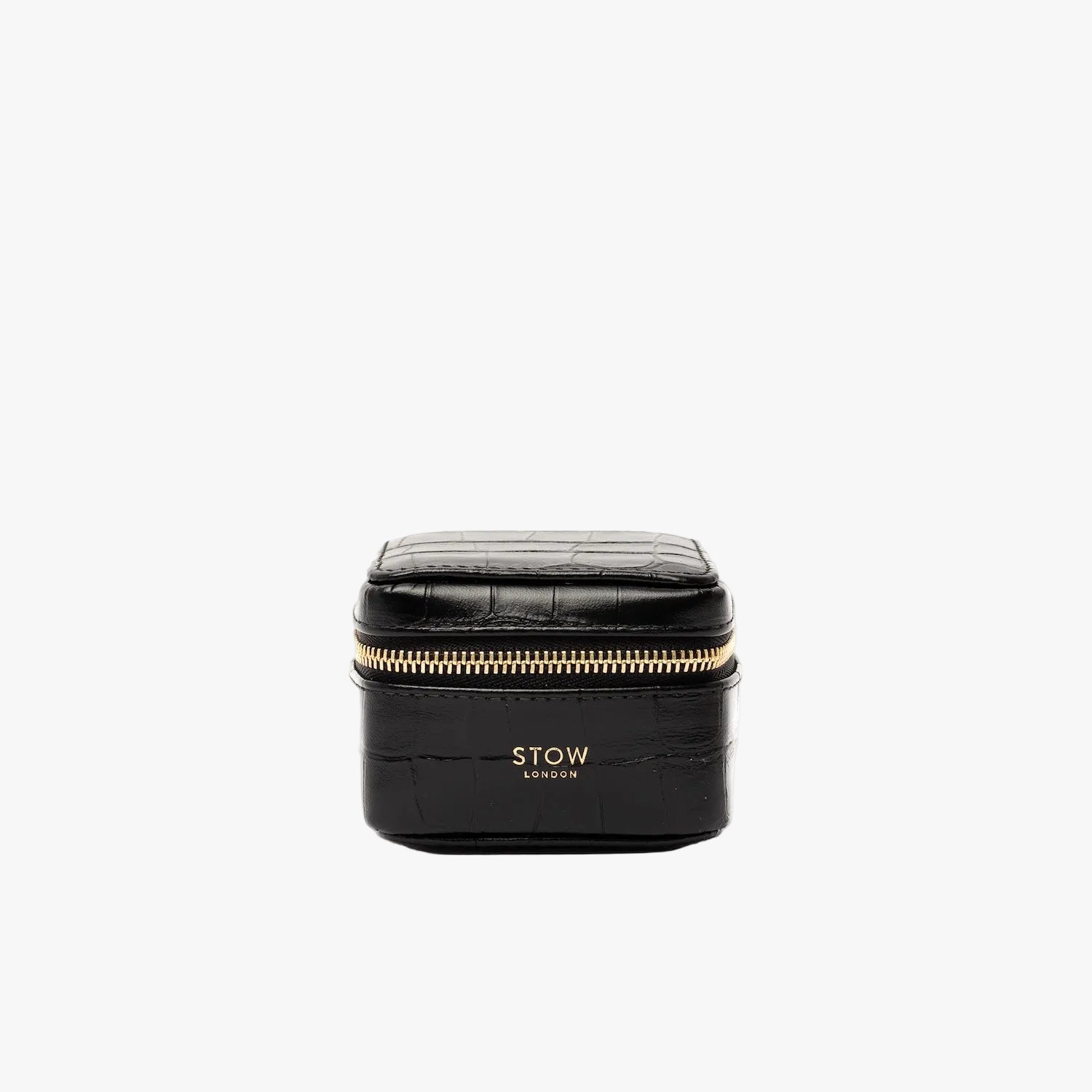 STOW London's Hester Jewellery Case in Black Embossed Croc leather on a light grey background featuring a YKK Natulon zip and fine gold embossed logo on the front
