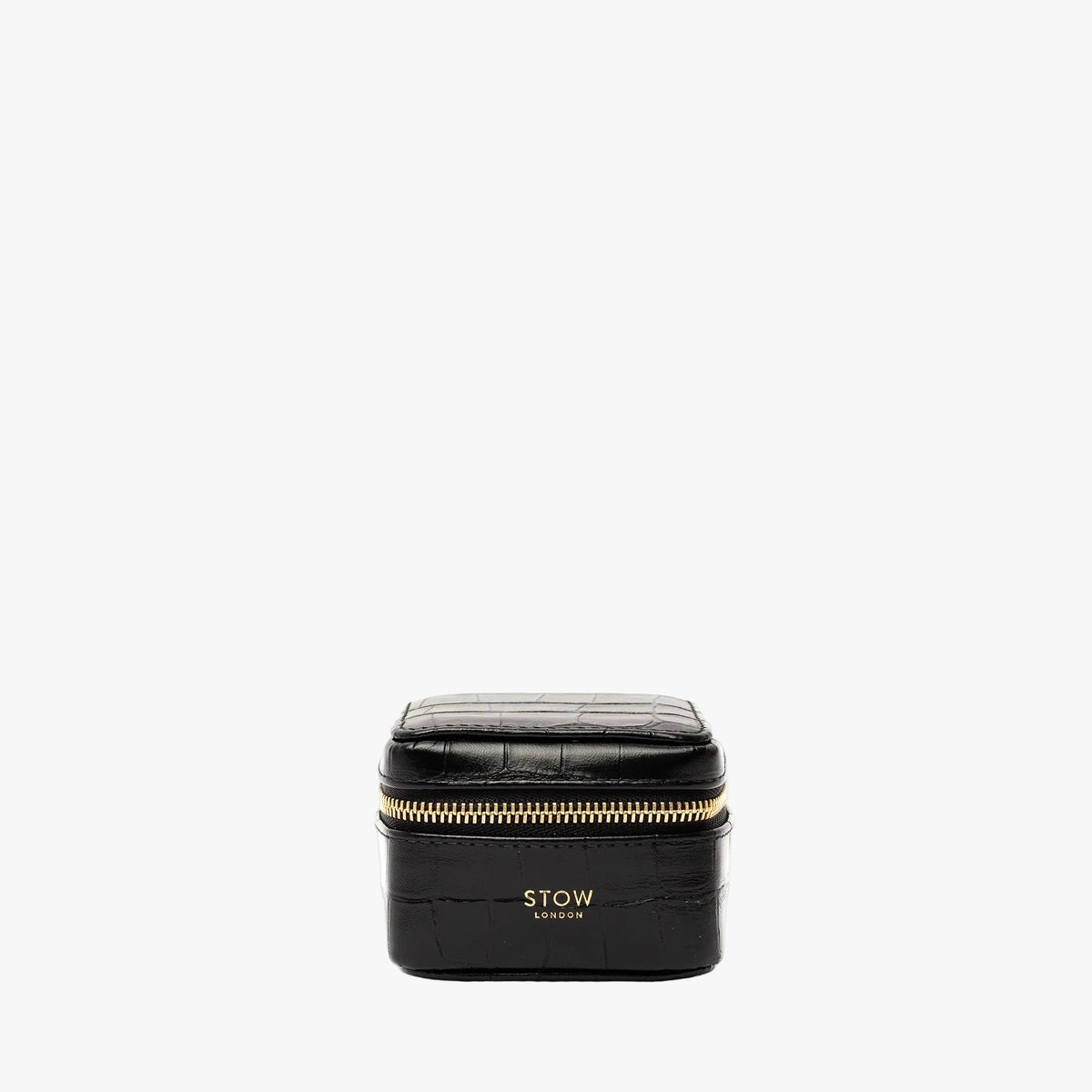 STOW London's Hester Jewellery Case in Black Embossed Croc leather on a light grey background featuring a YKK Natulon zip and fine gold embossed logo on the front