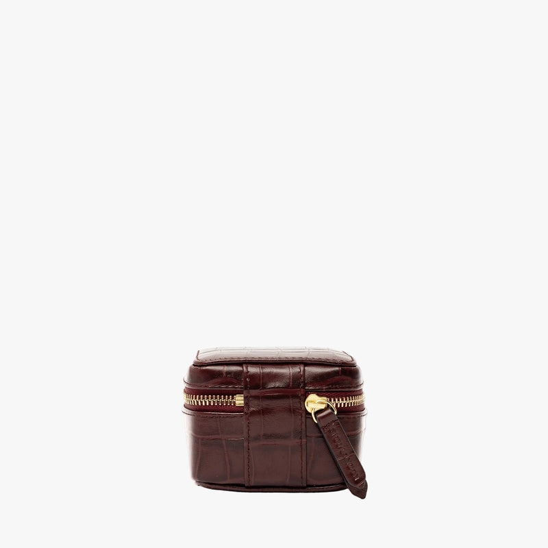 Back of STOW London's Hester Jewellery Case in Burgundy Embossed Croc leather on a light grey background featuring a YKK Natulon zip 