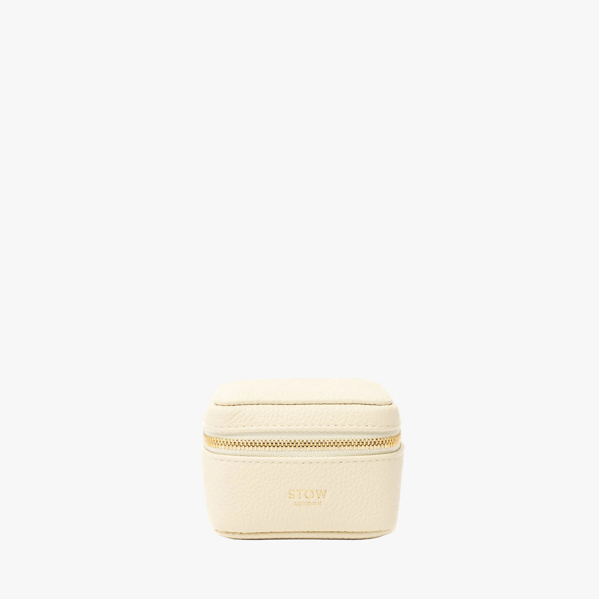 STOW London's Hester Jewellery Case in Spring Moon pebbled leather on a light grey background featuring a YKK Natulon zip and fine gold embossed logo on the front