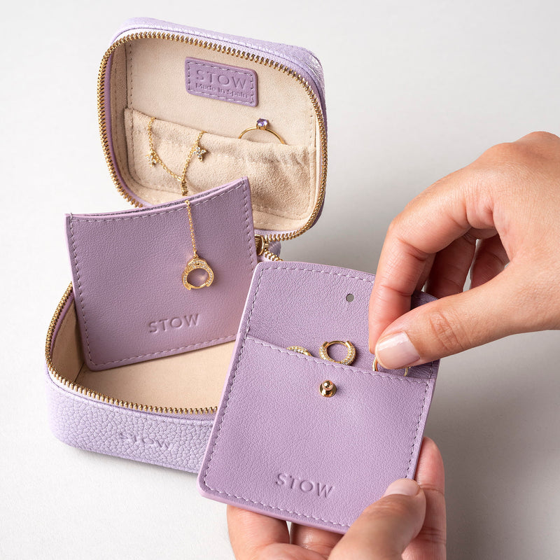 STOW Leather Hester Jewellery Case in Wild Lavender colour, open showing two leather sleeves inside (included with case) and an assortment of jewellery.