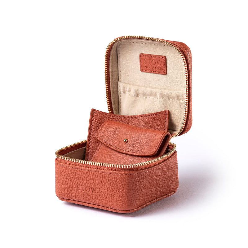 STOW Leather Hester Jewellery Case in Clay Orange colour, open showing two leather sleeves inside (included with case).