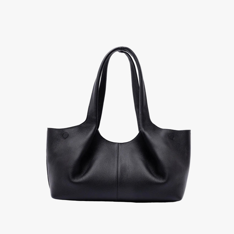 Back of STOW London's Hobo Tote in Black pebbled leather on a light grey background featuring a pleated back panel