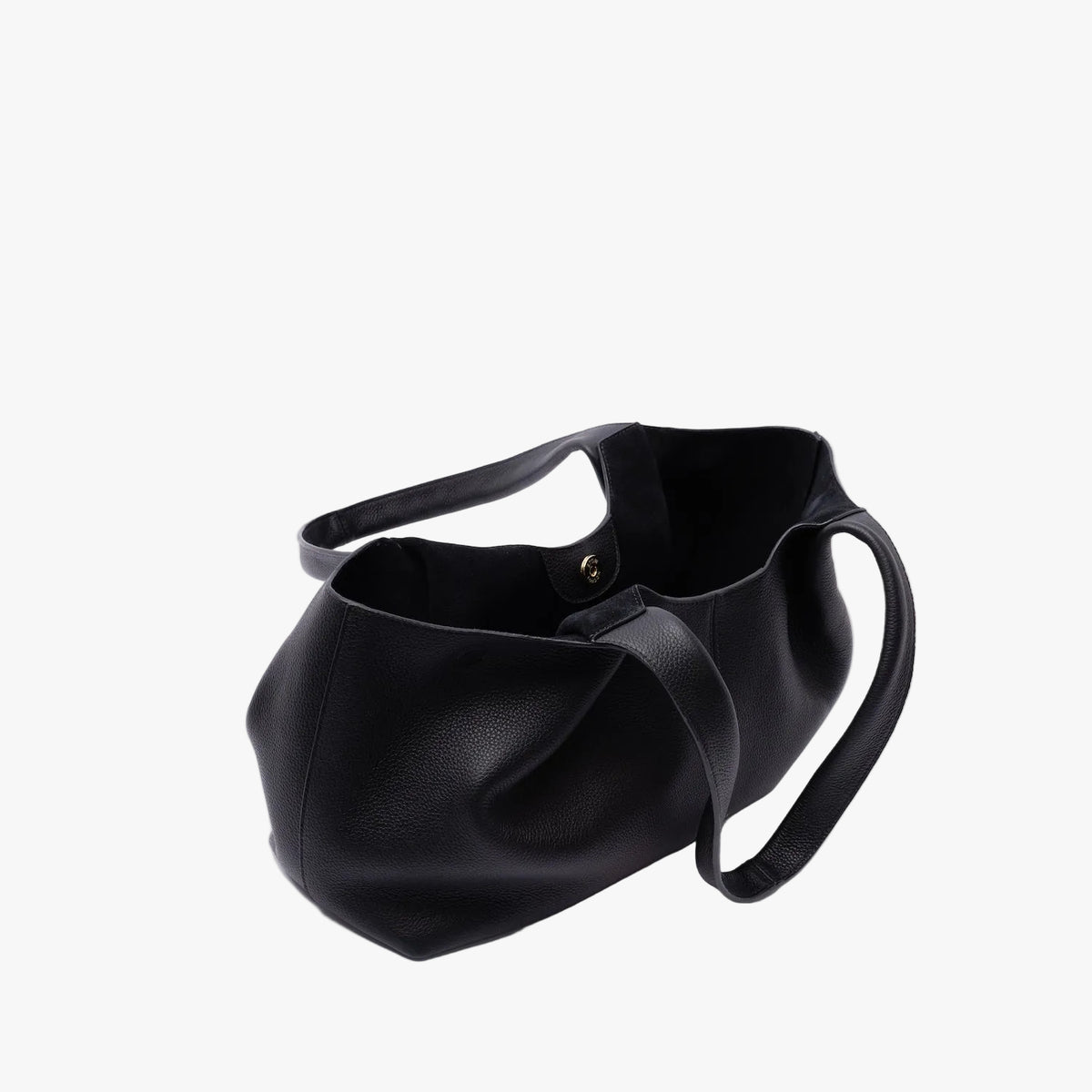 STOW London's Hobo Tote in Black pebbled leather on a light grey background with gold magnet open showing the black suede interior lining