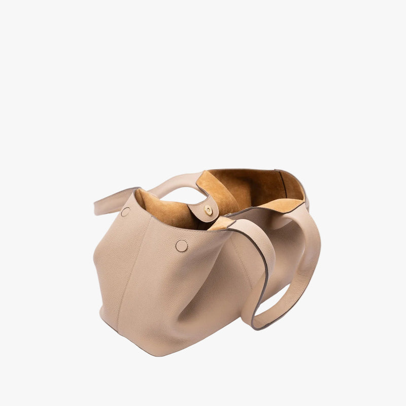 STOW London's Hobo Tote in Camel pebbled leather with gold magnetic closure open showing the suede interior lining on a light grey background featuring the side magnets