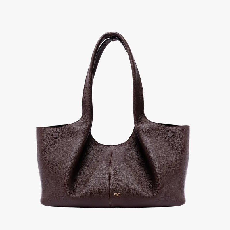 STOW London's Hobo Tote in Espresso pebbled leather on a light grey background featuring a pleated front panel and small gold embossed logo