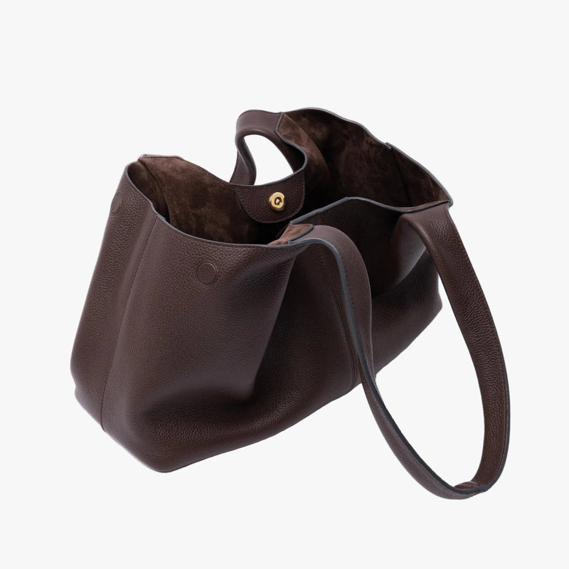 STOW London's Hobo Tote in Espresso pebbled leather with gold magnetic closure open showing the suede interior lining on a light grey background featuring the side magnets