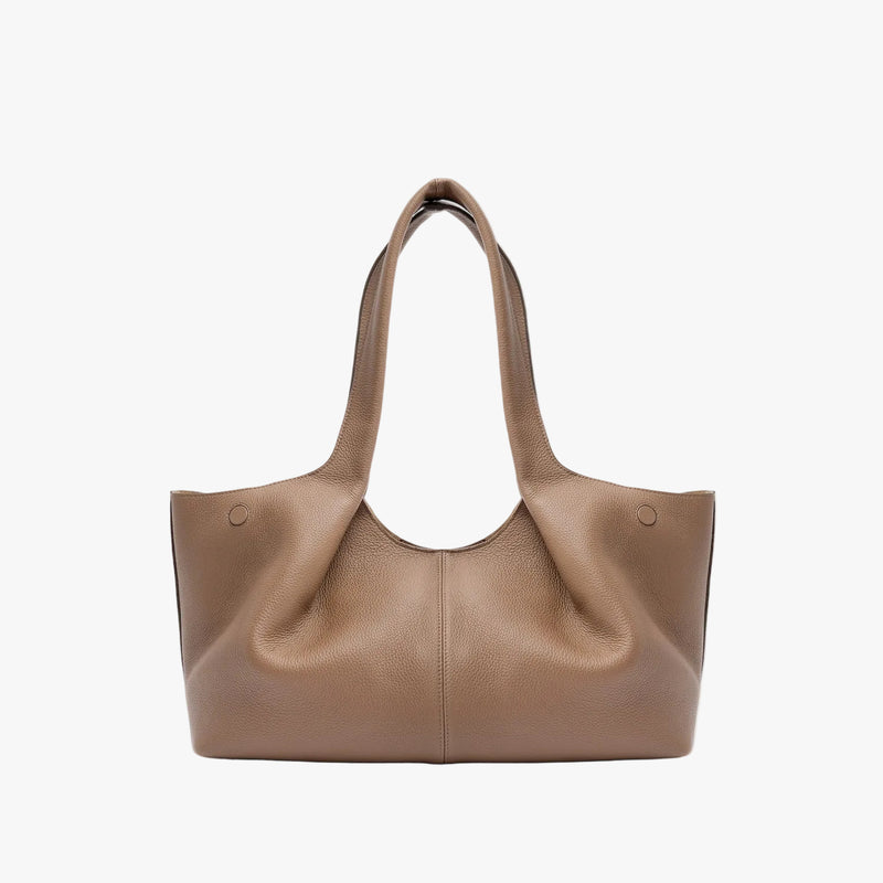 Back of STOW London's Hobo Tote in Mocha pebbled leather on a light grey background featuring a pleated back panel 