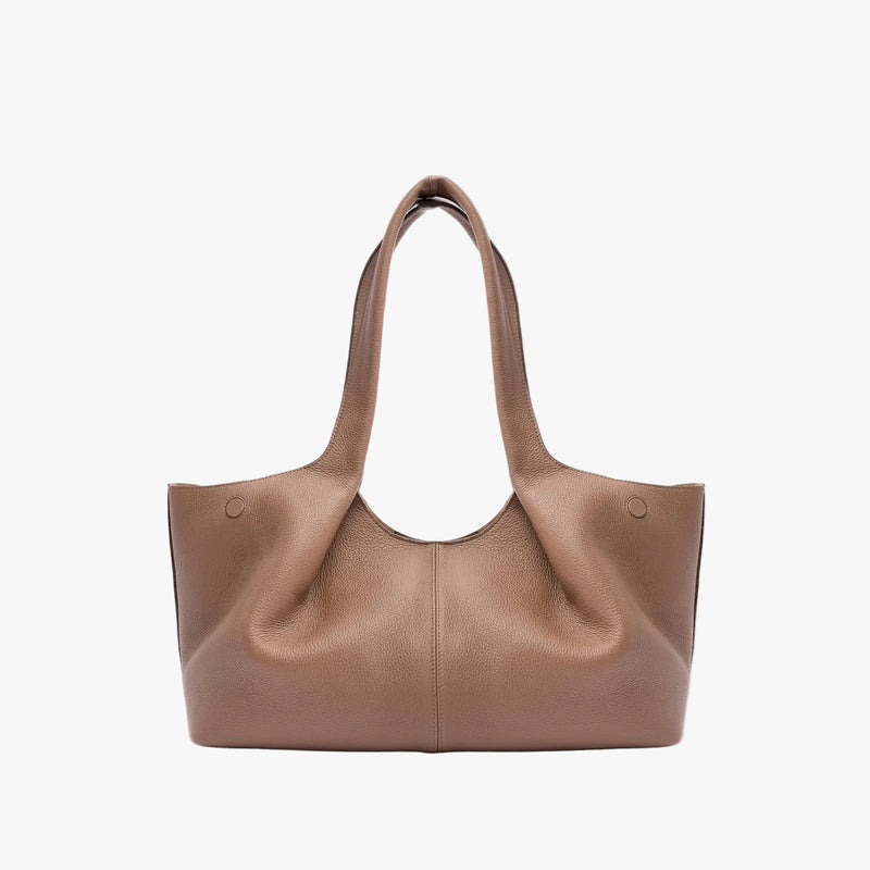 Back of STOW London's Hobo Tote in Mocha pebbled leather on a light grey background featuring a pleated back panel 