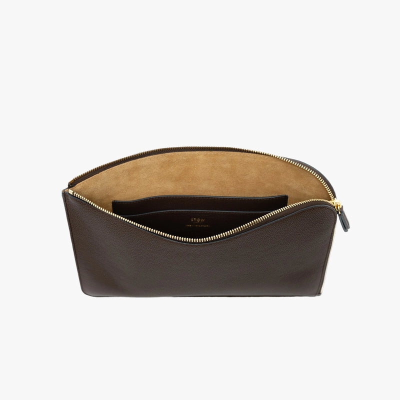 STOW London's Ipad Sleeve in Espresso pebbled leather on a light grey background with zip open showing the velvety suede interior and leather slip pocket 