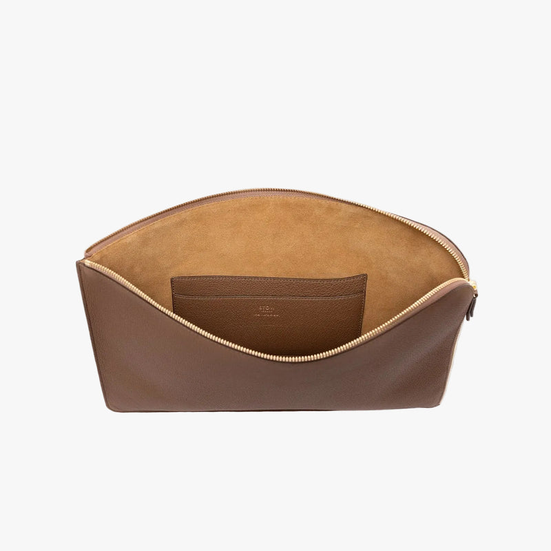 STOW London's Ipad Sleeve in Mocha pebbled leather on a light grey background with zip open showing the velvety suede interior and leather slip pocket 