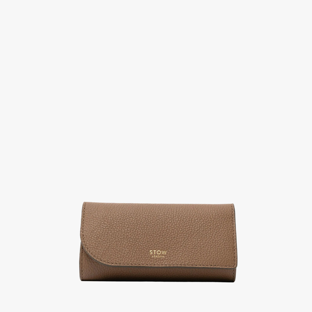 STOW London's Jewellery Roll in Mocha pebbled leather on a light grey background featuring a fine gold embossed logo on the front
