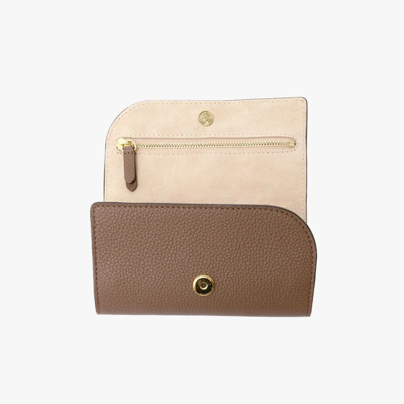 STOW London's Jewellery Roll in Mocha pebbled leather on a light grey background with magnets open showing a part of the interior suede lining and zip pocket