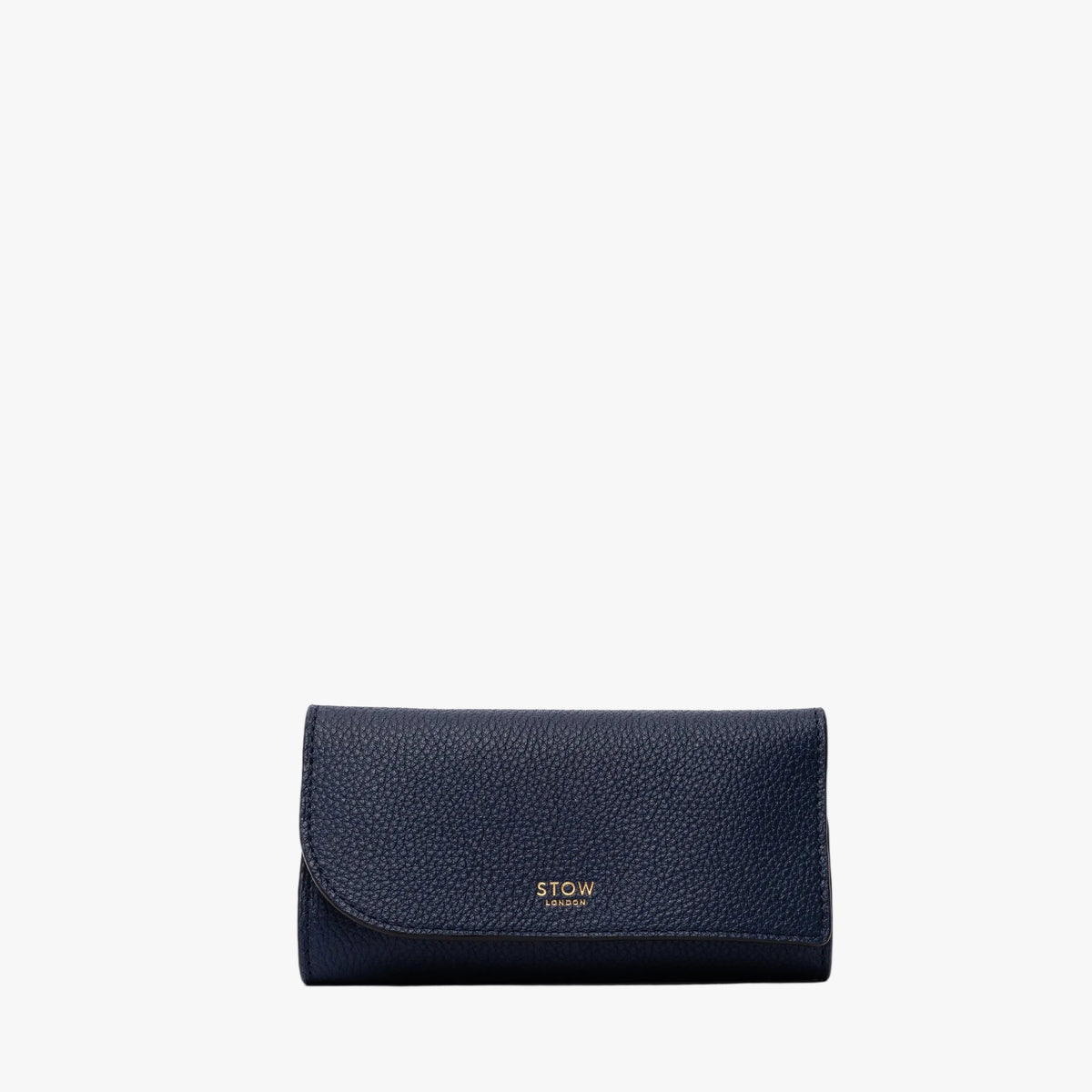 STOW London's Jewellery Roll in Navy pebbled leather on a light grey background featuring a fine gold embossed logo on the front