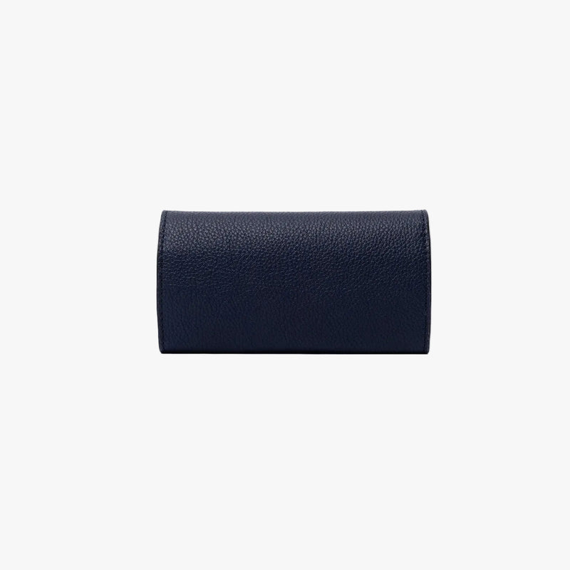 Back panel of STOW London's Jewellery Roll in Navy pebbled leather on a light grey background 