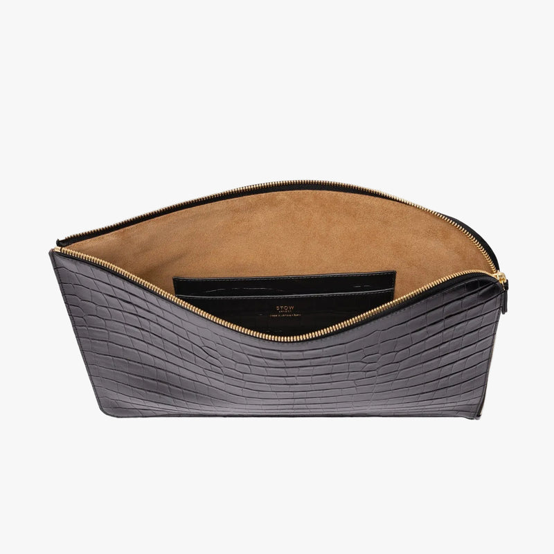 STOW London's Laptop Sleeve in Black Embossed Croc leather on a light grey background with zip open showing the velvety suede interior and leather slip pocket 