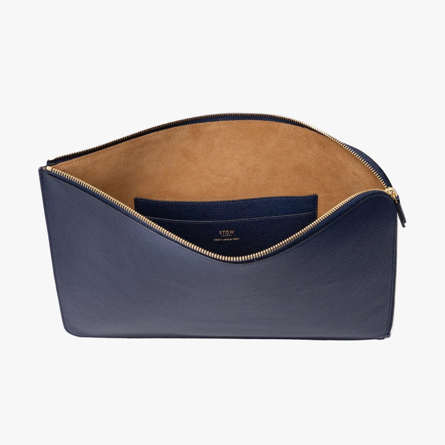 STOW London's Laptop Sleeve in Navy pebbled leather on a light grey background with zip open showing the velvety suede interior and leather slip pocket 